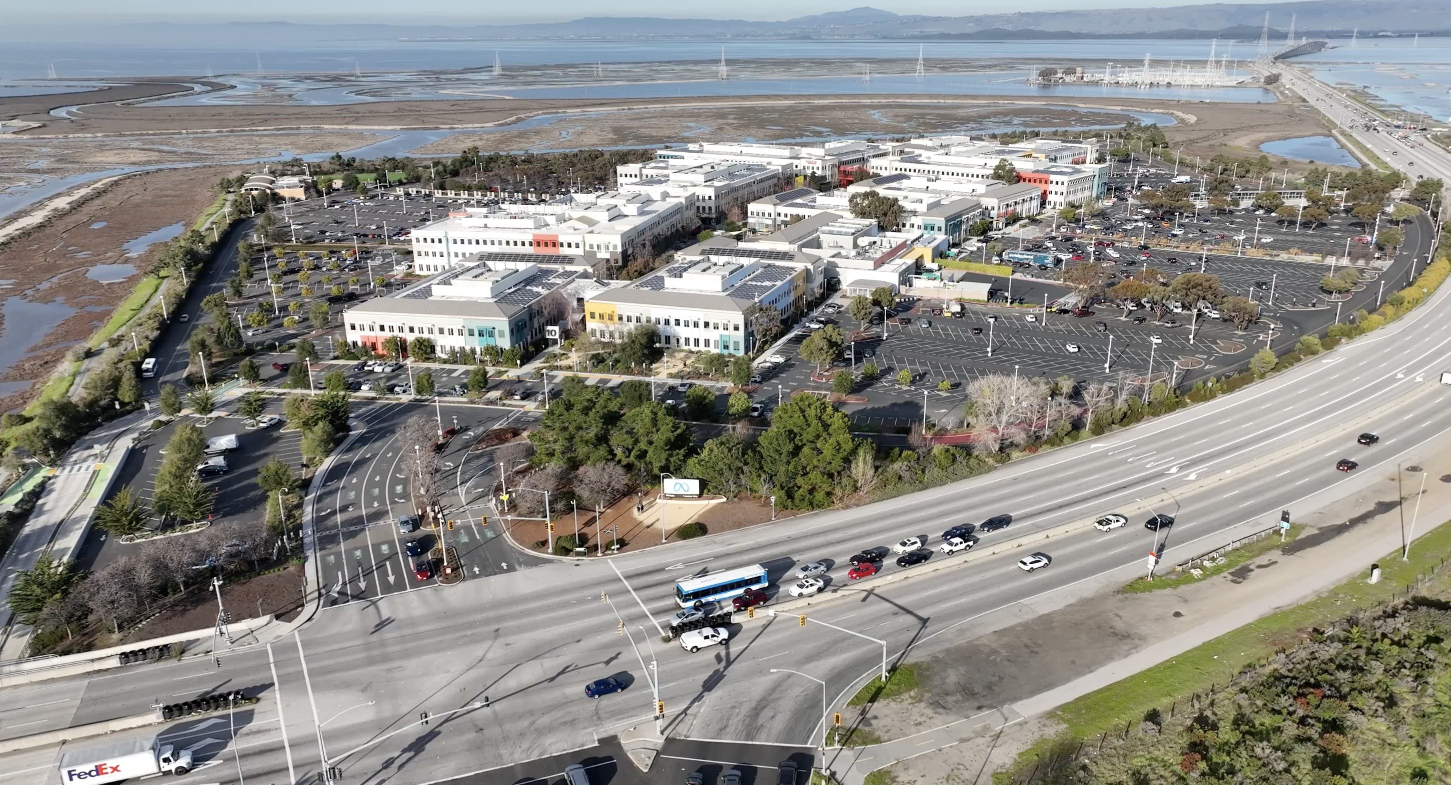 Aerial view of Meta Menlo Park headquarters with the Meta infinity-loop entrance sign