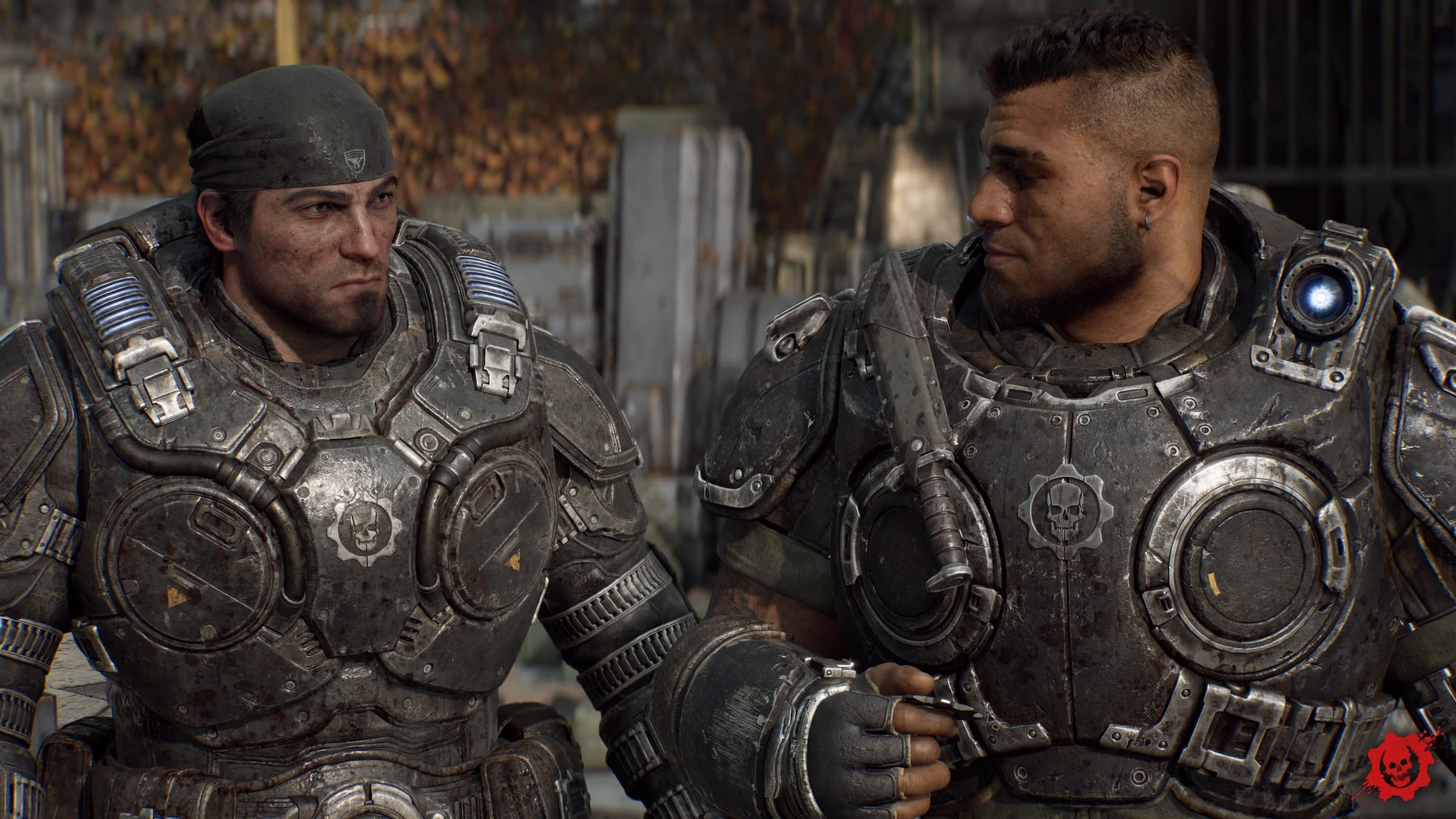 Official Gears of War: E-Day screenshot showing a close-up of Marcus Fenix in a dark bandana and armour beside Dom Santiago against a blurred autumn background