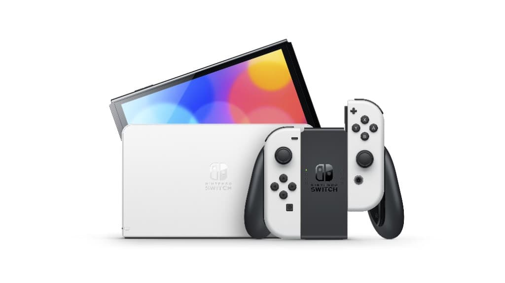 White Nintendo Switch OLED console, dock, and Joy-Con grip on a studio background